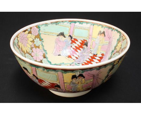 A Chinese porcelain bowl decorated with flowers and figures in polychrome enamel. 25.5cm diameter.