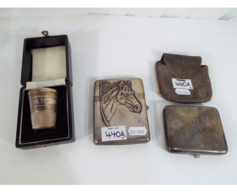 A George V hallmarked cigarette case, London assay 1924 in protective case, a further Indian silver cigarette case with relie