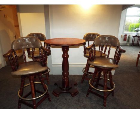 A mahogany bar table with four swivel bar stools with green faux leather seats and button back, approx table size 110cm (h) x