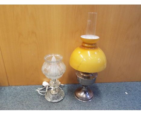 An Aladdin No. 21 oil lamp with amber coloured shade 60 cm (h) and a glass table lamp 34 cm (h). (2)