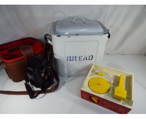 A vintage Fisher Price music box record player with five records, an enamelled bread bin and a Minolta vintage camera with ca