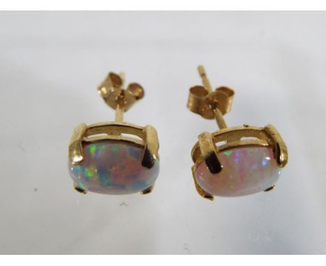 A pair of 9 carat gold and opal stud earrings