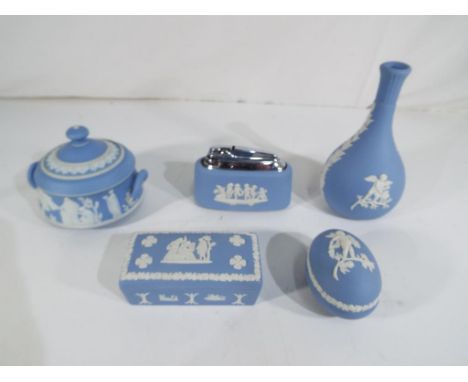 Wedgwood - five pieces of Blue Jasperware comprising table lighter, bud vase, lidded trinket box and similar (5) Est £25 - £4