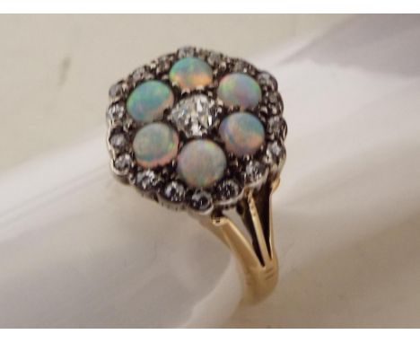 A lady's 18 carat diamond and opal ring, approx. 4.2 gm, size O - Est £80 - £120