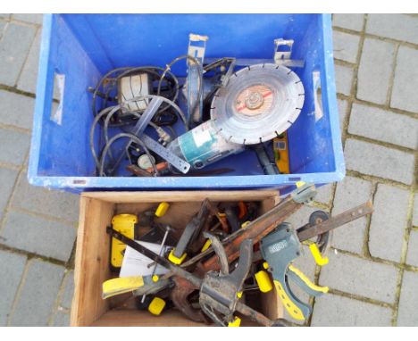 Two boxes containing a quantity of tools and accessories to include a Makita 9069 240 watt angle grinder, clamps, lights and 