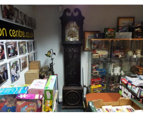 An 18th century style brass dial 8-day longcase clock, the dark oak coloured case classically styled with features typical of