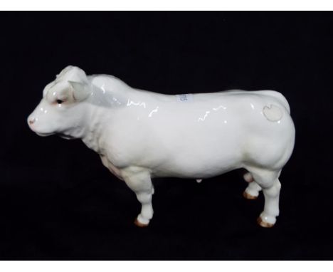 A ceramic model of a bull by Border Fine Arts in cream. 13 cm (h)