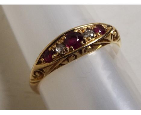 A lady's hallmarked 18 carat yellow gold ring set with diamond and ruby, approx. 2.6 gm (all in), size N + ½ - Est £30 - £50