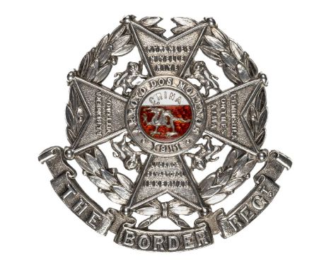 *The Border Regiment. Officer's post 1897 glengarry badge,  white metal with Maltese cross bearing battle honours on a laurel