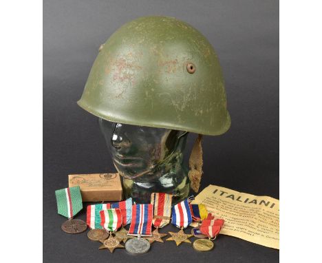 *WWII. Italian steel helmet,  with original brown leather liner punched '58' (size), with Italian propaganda leaflet and WWII