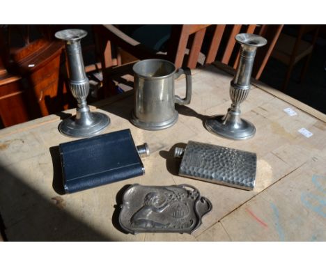 A pair of pewter candlesticks; a tankard; two hip flasks; an Art Nouveau dish