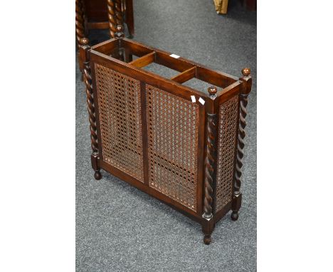 A 1930's/40's oak barley twist stick stand, with wickerwork sides and back