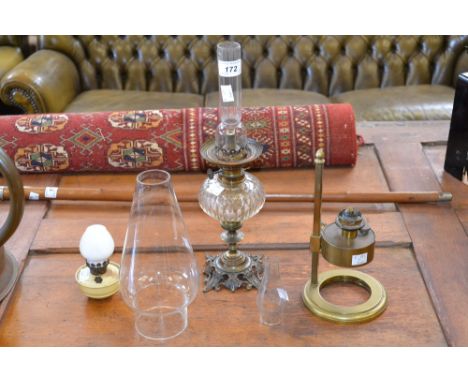An Art Nouveau oil lamp with Fidelitas Brand glass flue by Johns & Son oil & colour merchants, Gloucester and Sharpness; an a