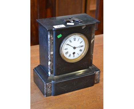 A black slate mantel clock with Roman numerals, marble decoration, breakfront plinth base, with key