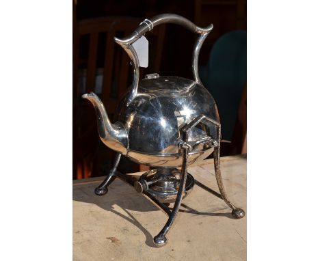 An Art Deco silver plated spirit kettle on stand, with burner