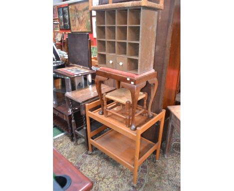 An oak barley twist dropleaf tea trolley; two rope seated stools; a wall shelf; a mahogany stool; a tea trolley; an iron work