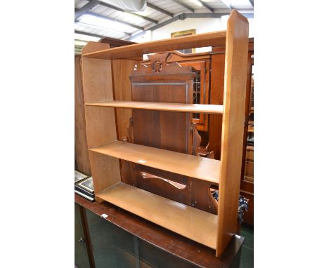 A retro light oak four tier book shelf