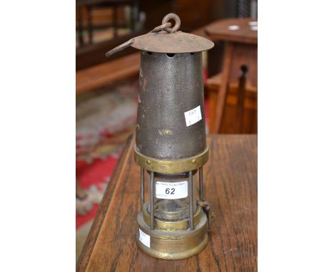 A Davis Kirkby type 2 Colliery/Miners lamp, iron chimney, removable reservoir, badge No 467