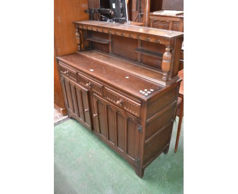 A Priory style oak buffet sideboard