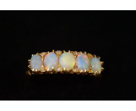 18 ct gold ring set with 5 opals size- N