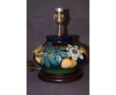 A Moorcroft lamp on a wooden base 
