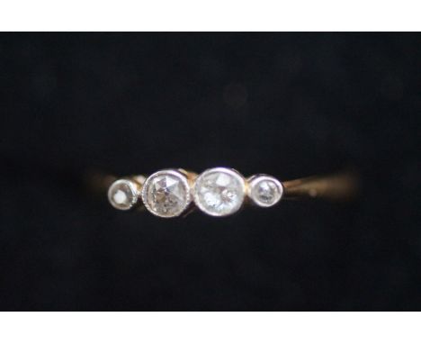 18ct Gold &amp; diamond ring, 2 diamonds approx 1/8 carat, 2 smaller diamonds approx 1/32 carat. Size L 