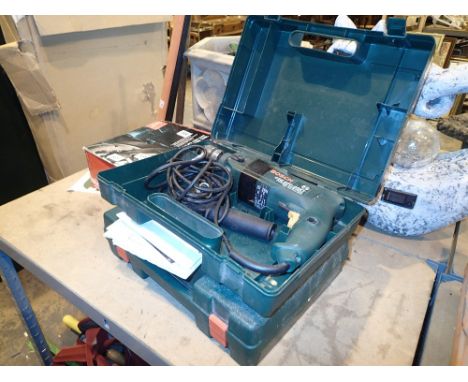 Two Bosch power tools, one jigsaw and a power hammer drill, both with manuals 