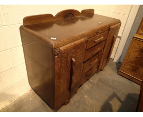 Vintage oak sideboard with twin cupboards and four central drawers 