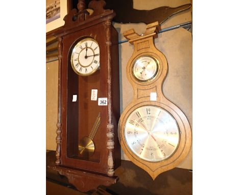 Two wall clocks one with a barometer 