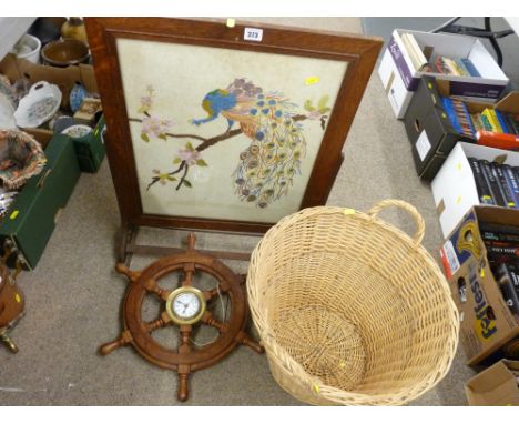 Oak framed firescreen, a small reproduction ship's wheel with centre clock and a two handled log basket