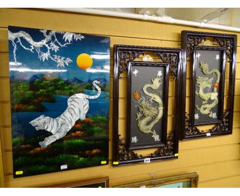 Pair of exotically framed Oriental 'Jade' dragons and a lacquerwork and mother of pearl decorated panel of a tiger