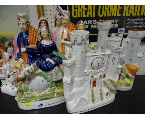 Three large Staffs pottery Scottish figure clock figurines and two watch tower spill vases