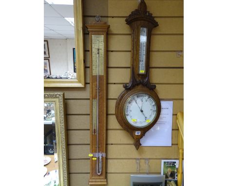 Large oak framed circular dial aneroid wall barometer and a reproduction stick barometer with full mercury glass tube