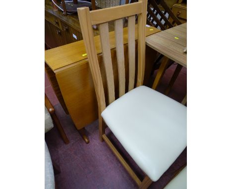 Light wood drop leaf table and four chairs with cream faux leather seats