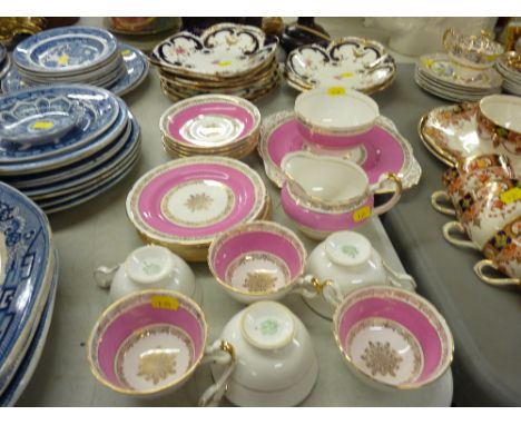 Pink and gilt Grafton china twenty one piece tea service and a parcel of Coalport gilt, blue and floral china serving dishes 