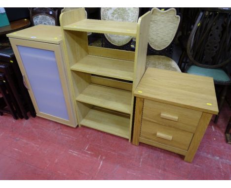 Three modern light wood items of storage furniture