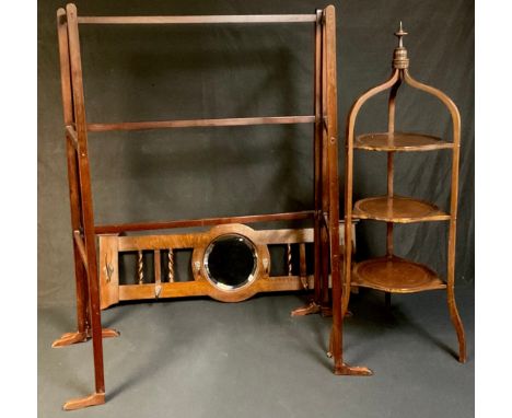 An Edwardian mahogany inlaid three tier tripod cake stand, spire finial, 95cm; an oak hall mirror with coat hooks and barley 