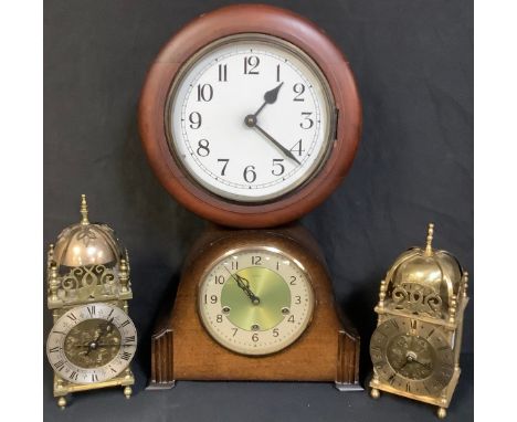 A 1940's Smiths mantel clock; a mahogany circular wall clock; a brass lantern clock; another (4) 