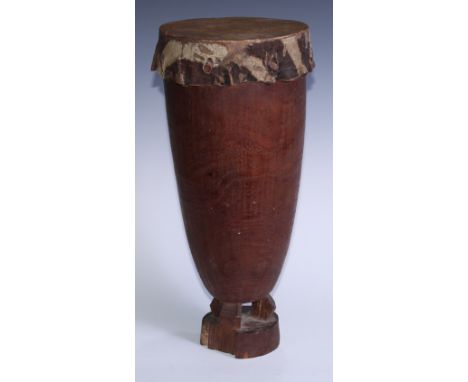 Tribal Art - An African drum, hide skin, pierced carrying loop, geometric socle, 42cm high, possibly Igbo, Nigeria 