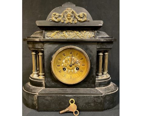 A late 19th century French black slate mantel clock, brass mounted arched case, pierced brass dial with Roman numerals, twin 