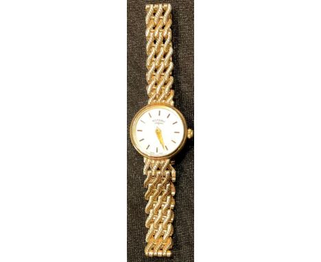 A lady's 9ct gold Rotary wristwatch, white dial with baton indicators, integral 9ct gold bracelet strap, marked 375, 14.3g 