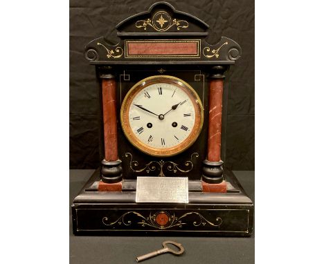 A late 19th century French black slate and rouge marble architectural mantel clock, white enamel dial, twin winding holes, ch