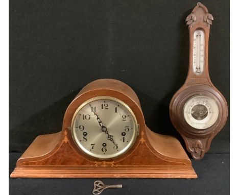 A 20th century Napoleon hat mantel clock, c.1930;  am early 20th century barometer (2) 