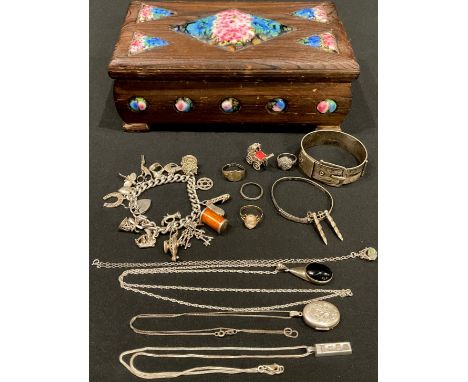 A 9ct gold cameo ring, size Q, marked 375, 2.42g; a silver curb link charm bracelet, including baby's pram, carousel, magic l