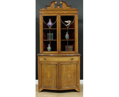 A Sheraton Revival satinwood crossbanded mahogany and marquetry book or display cabinet, the bookcase superstructure with swa