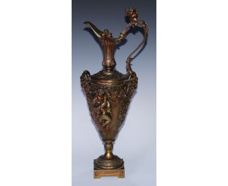 A Renaissance Revival gilt bronze Cellini type ewer, boldly cast with Bacchic masks, revelling putti and fruiting vine, scrol