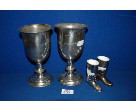 A pair of Victorian silver on pewter Communion Cups together with a pair of Spirit Measures in the form of boots.