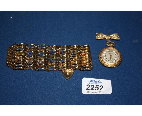 A gold plated Gate Bracelet and a Savoy dress watch Brooch