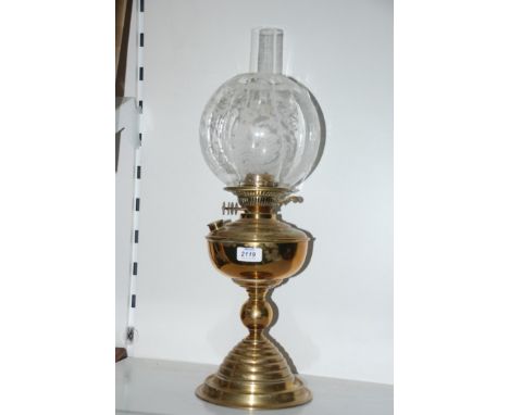 A Brass oil Lamp with patterned globe, a/f