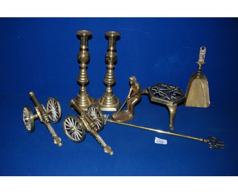 A quantity of Brass including candlestick, trivet, golfer, cannons, etc.